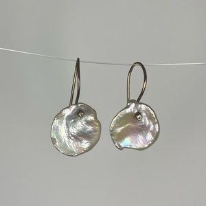 Flat pearl earring with small diamond at top with gold back